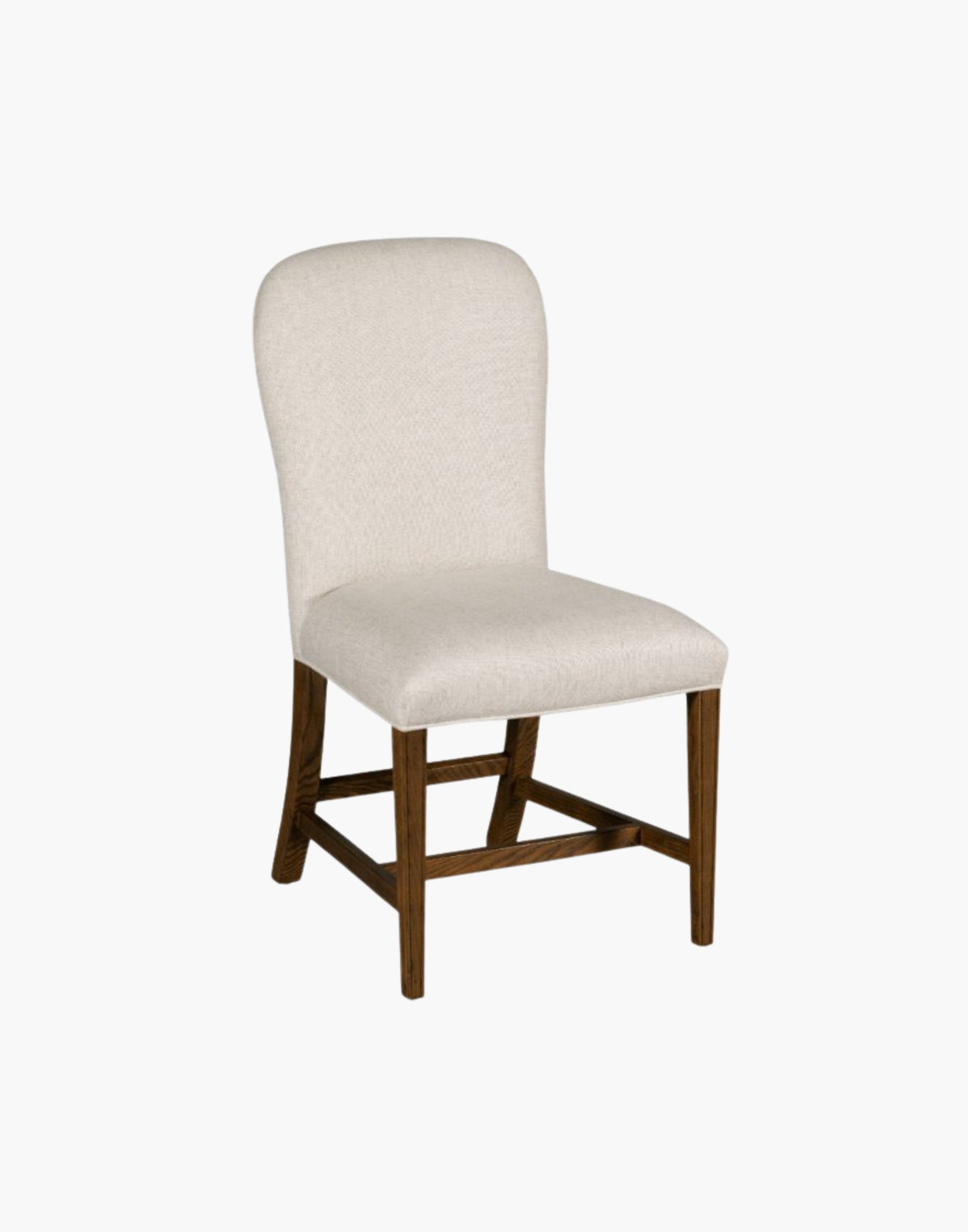 Fully upholstered gentle balloon shaped back resides over an upholstered seat with gracefully tapering legs.
