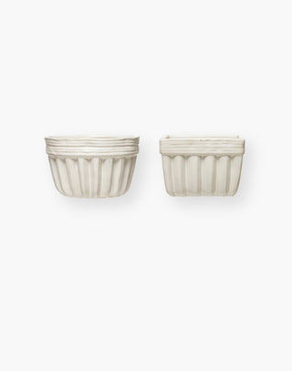 Small, white circular and square bowls with ridges