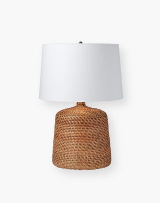 Jug-style table lamp covered in flat-weave glossy rattan in a dark honey finish.
