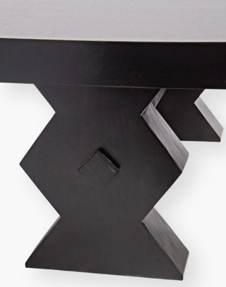 Solid Wood rectangle coffee table supported with 4 legs with a geometric zig zag cut out design in a hand rubbed black finish