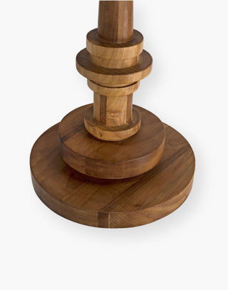Hand-carved of solid teak side table features a circular base with coordinating round top