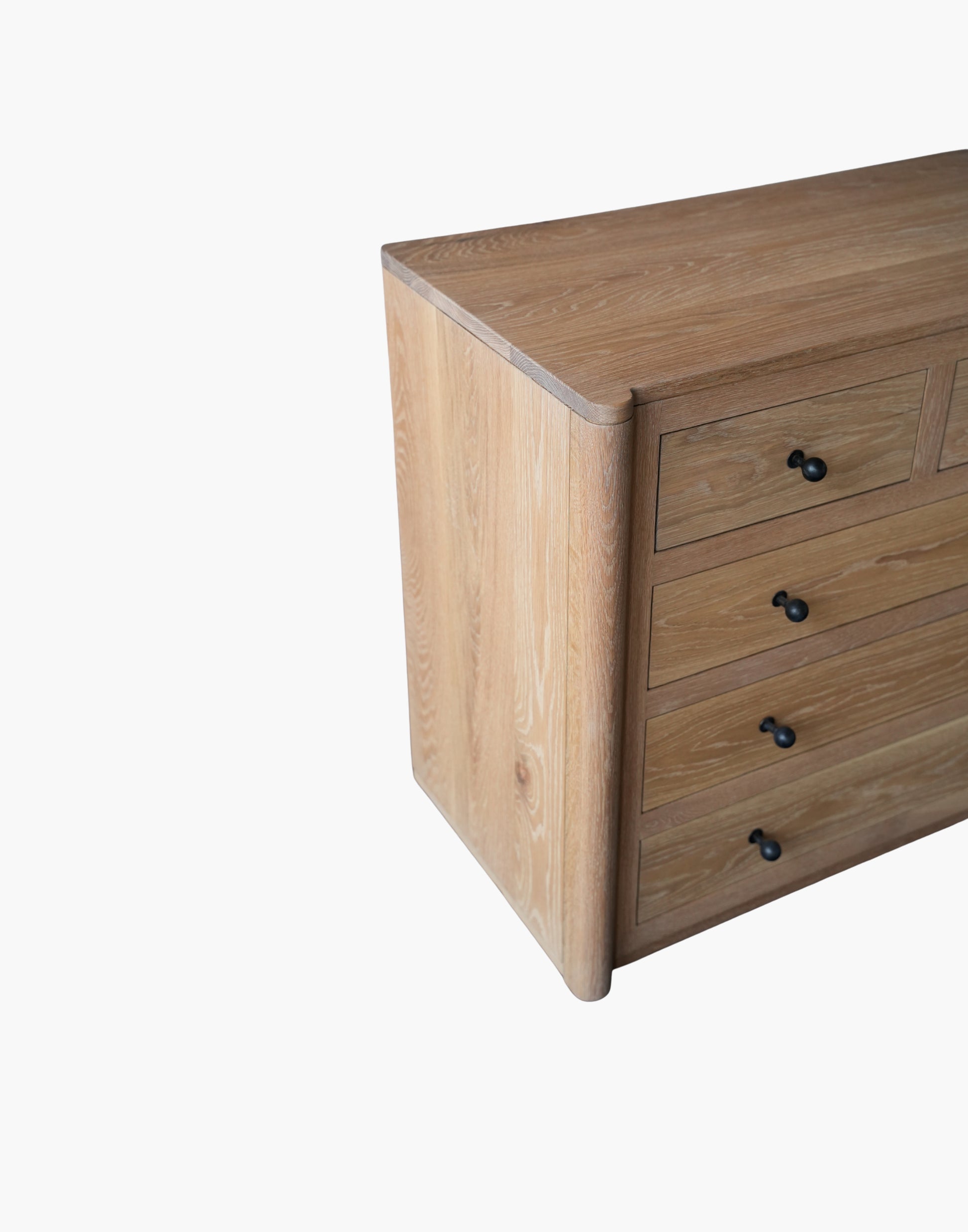 Handcrafted white oak nightstand with soft-close drawers, natural hardwax oil finish, and USB-C charging dock.