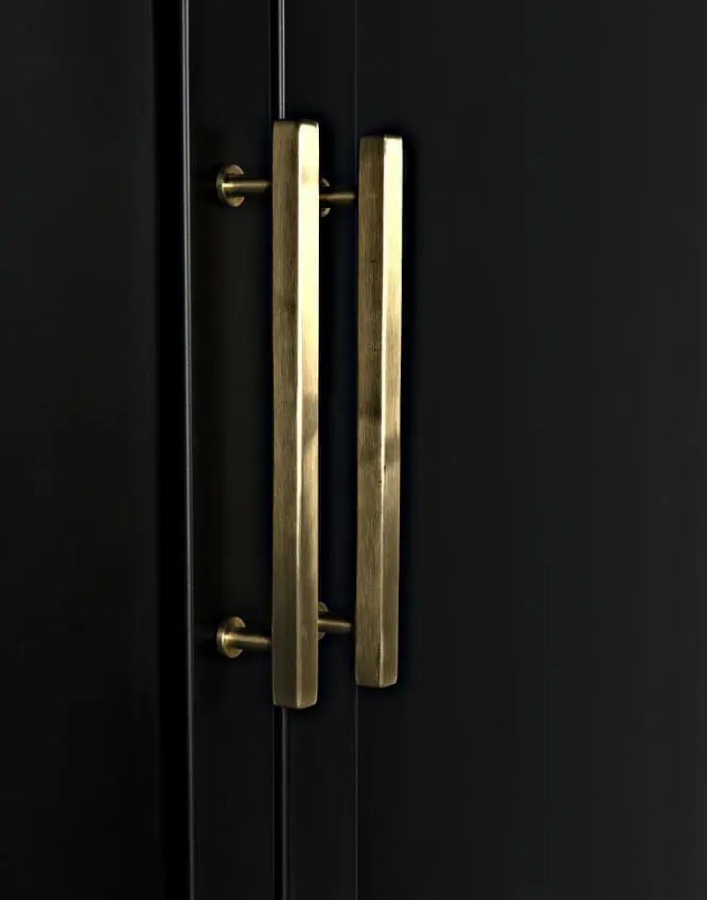 Matte black iron hutch with brass hardware and three open shelves for modern storage and display.