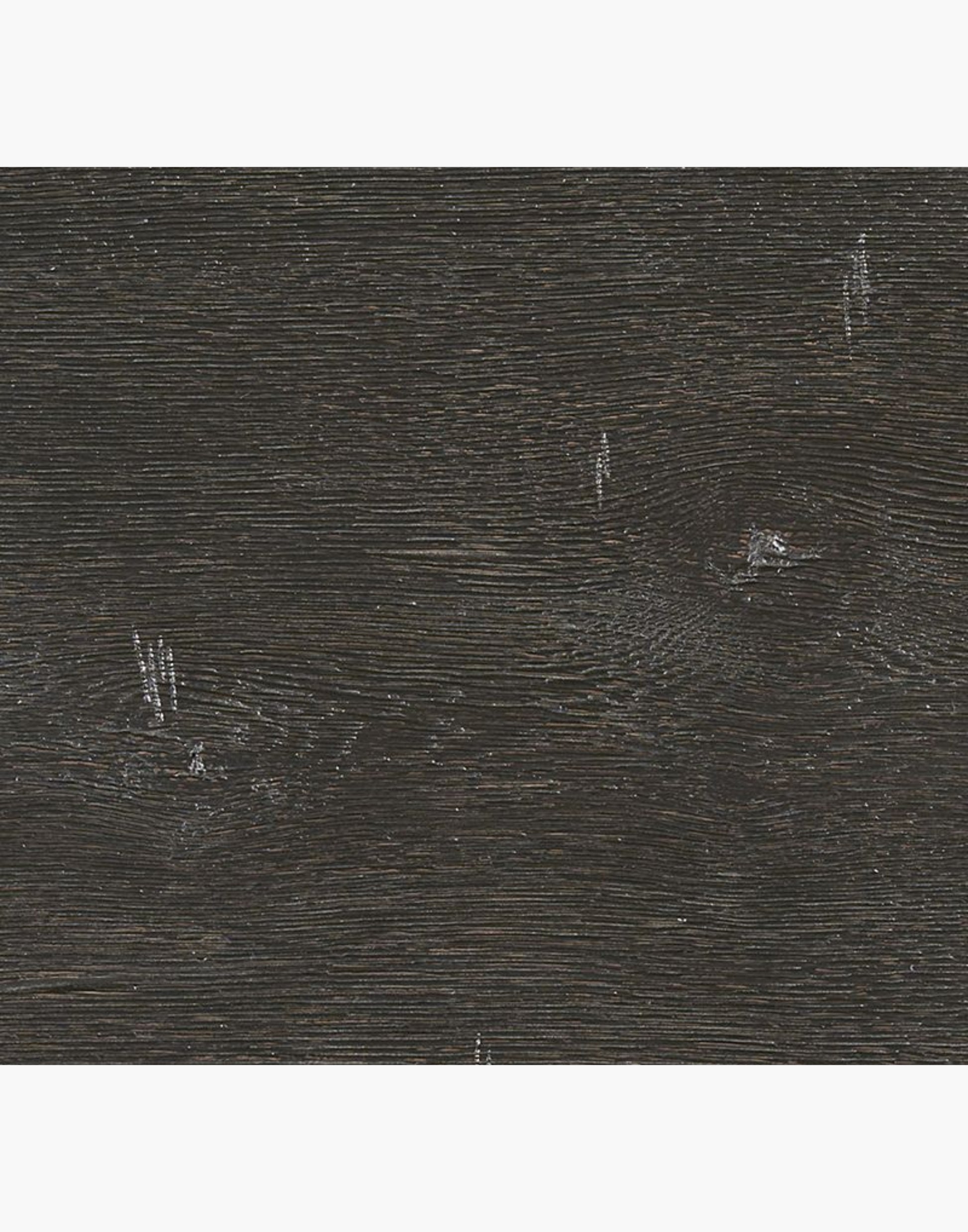Black bookcase with 4 open adjustable shelvings made of solid oak with subtle distressed finished in black and an intricate 19th century inspired design at the top of bookcase and arch shaped bracket base