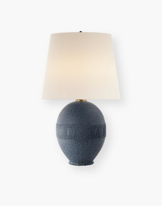 Blue ceramic texture lamp with a linen shade.