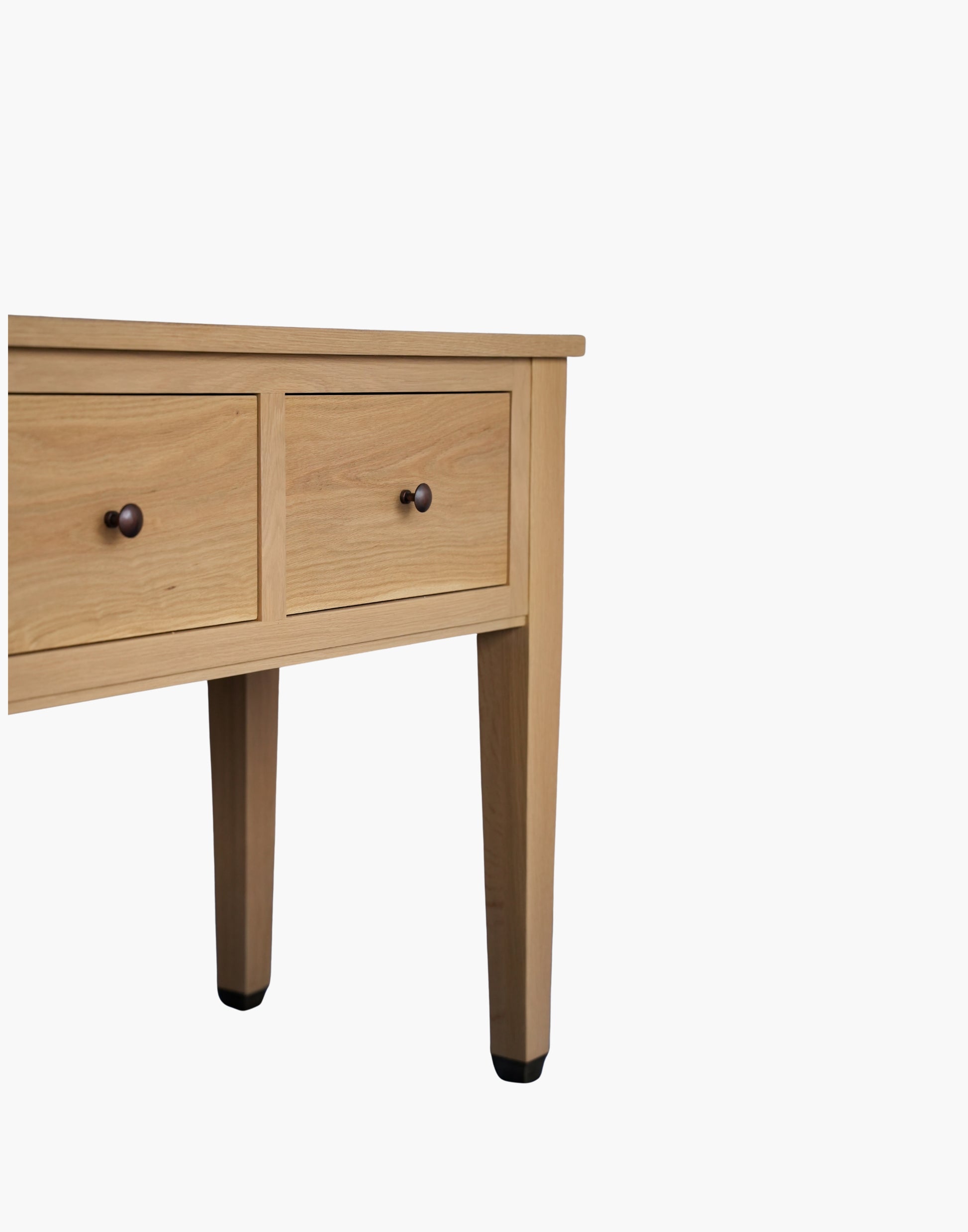 Handcrafted white oak console table with Amber Pine finish, soft-close drawers, metal caster cup feet, and integrated USB-C charging outlets.
