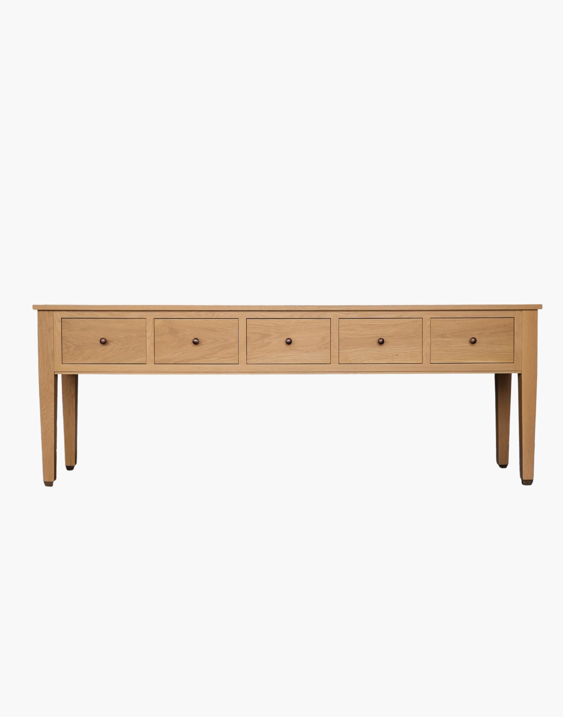 Handcrafted white oak console table with Amber Pine finish, soft-close drawers, metal caster cup feet, and integrated USB-C charging outlets.