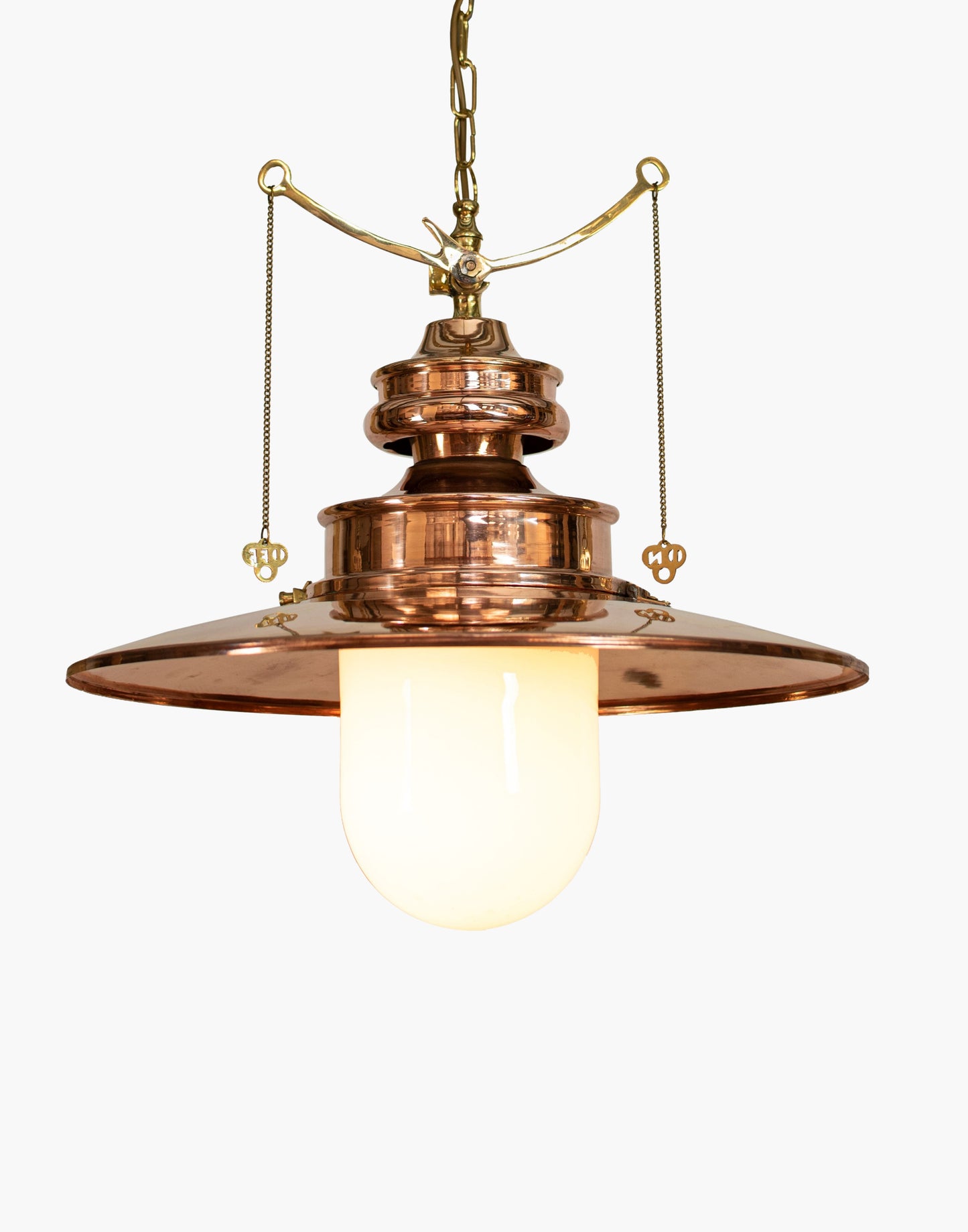 pendant light in solid copper with brass details and clear or opal glass shade