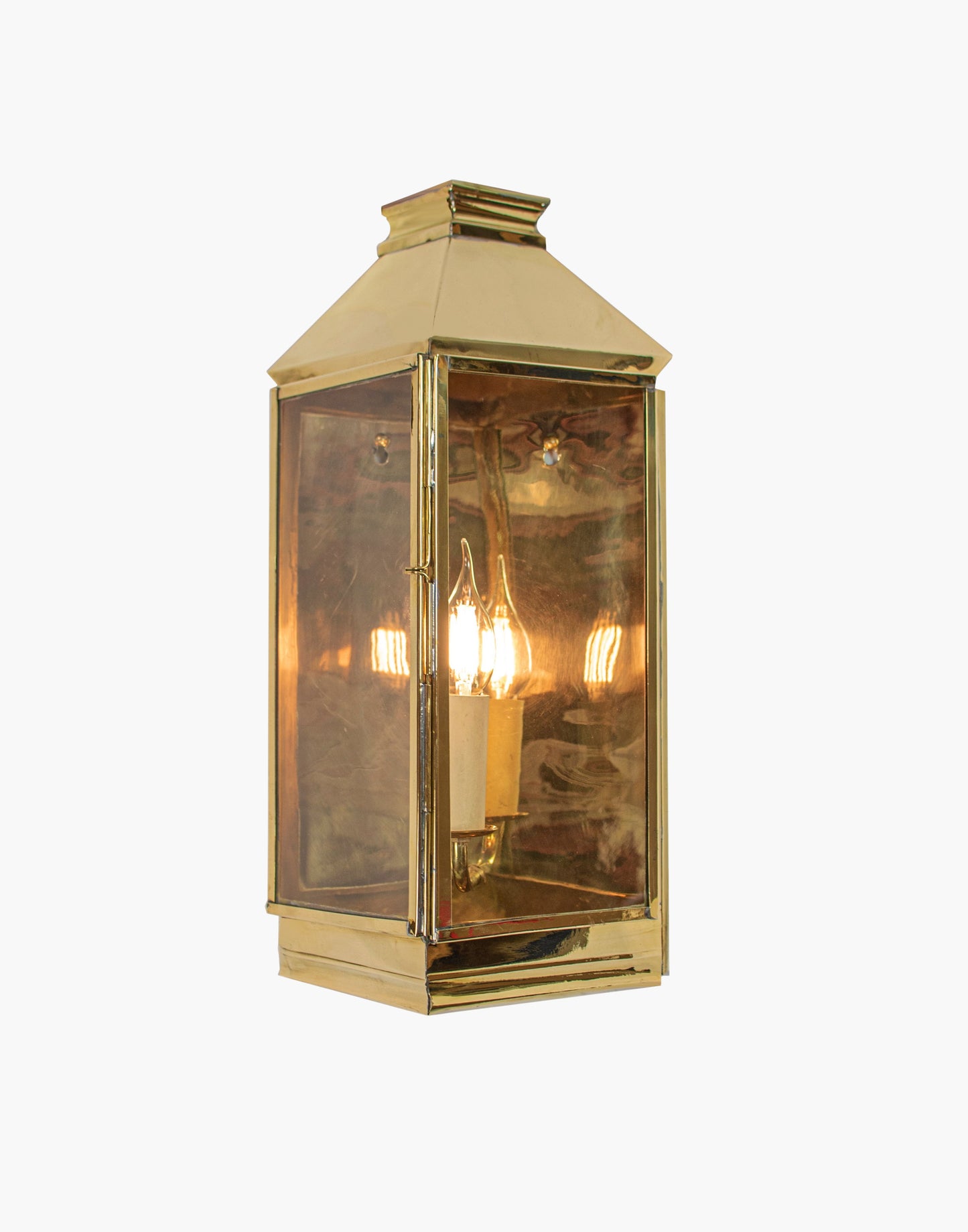 Wall Lantern in solid brass featuring a classic three sided French lantern design, wet rated for outdoor walls, porches, and entryways.