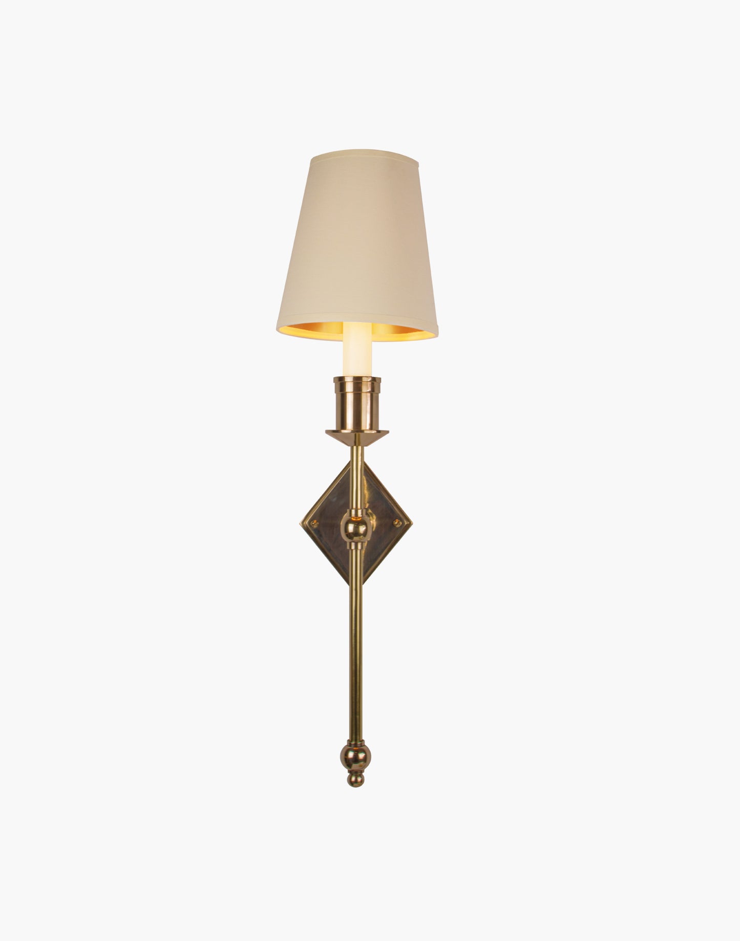 Wall sconce in cast and machined brass with diamond-shaped scalloped backplate and optional shade.