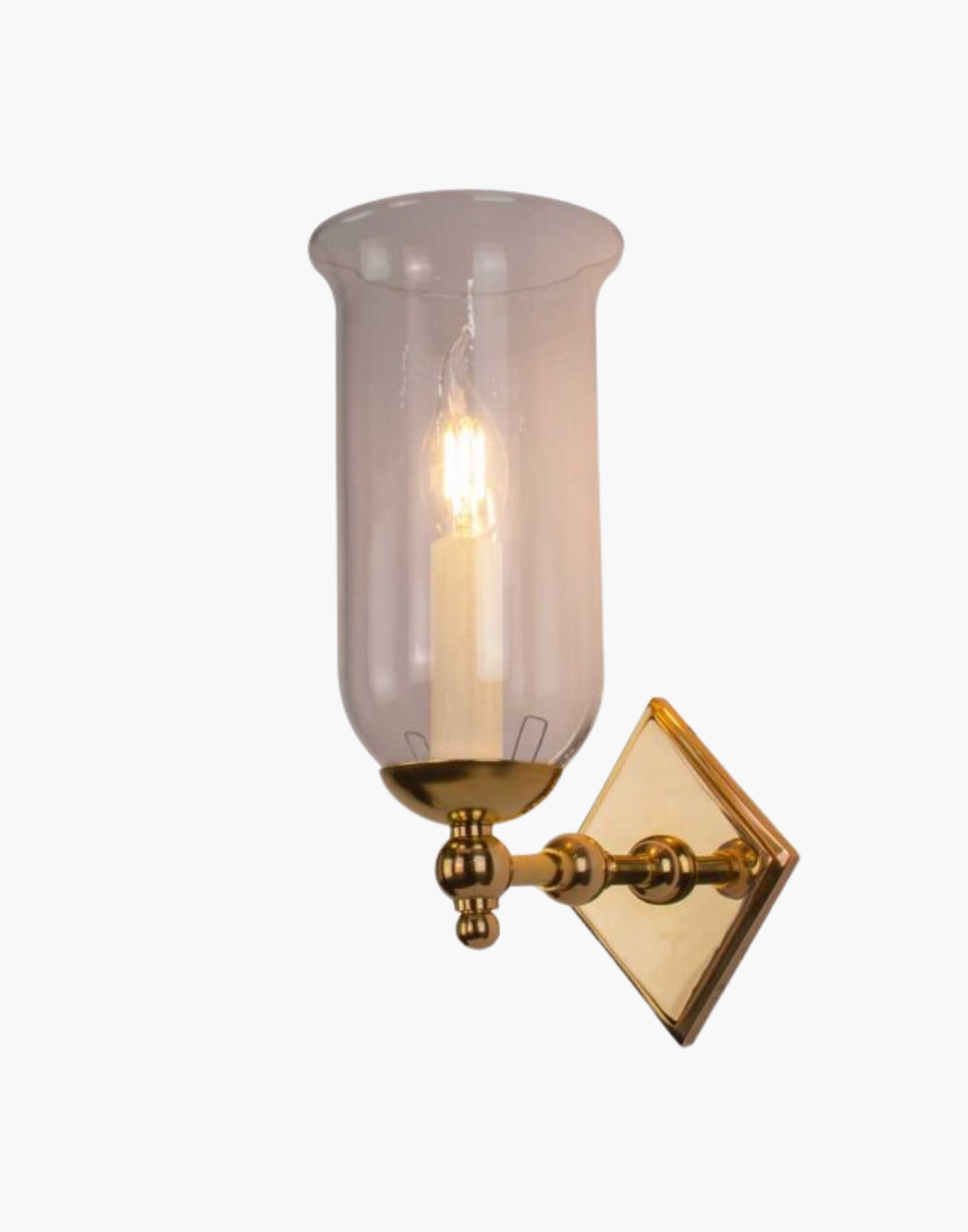 Christina Storm Glass Wall Sconce in solid brass with diamond-shaped backplate and scalloped edge. Rustic yet elegant, suits traditional and contemporary interiors.