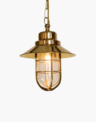 Wheelhouse Nautical Pendant in solid brass with clear glass. Inspired by ship lights from 1910, perfect for nautical-themed interiors.