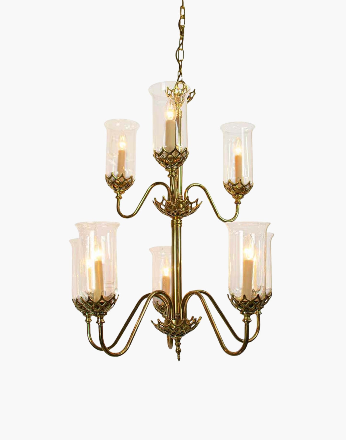 Eight arm chandelier in cast brass with clear storm glasses, statement period ceiling light inspired by an 1800 Irish church original.