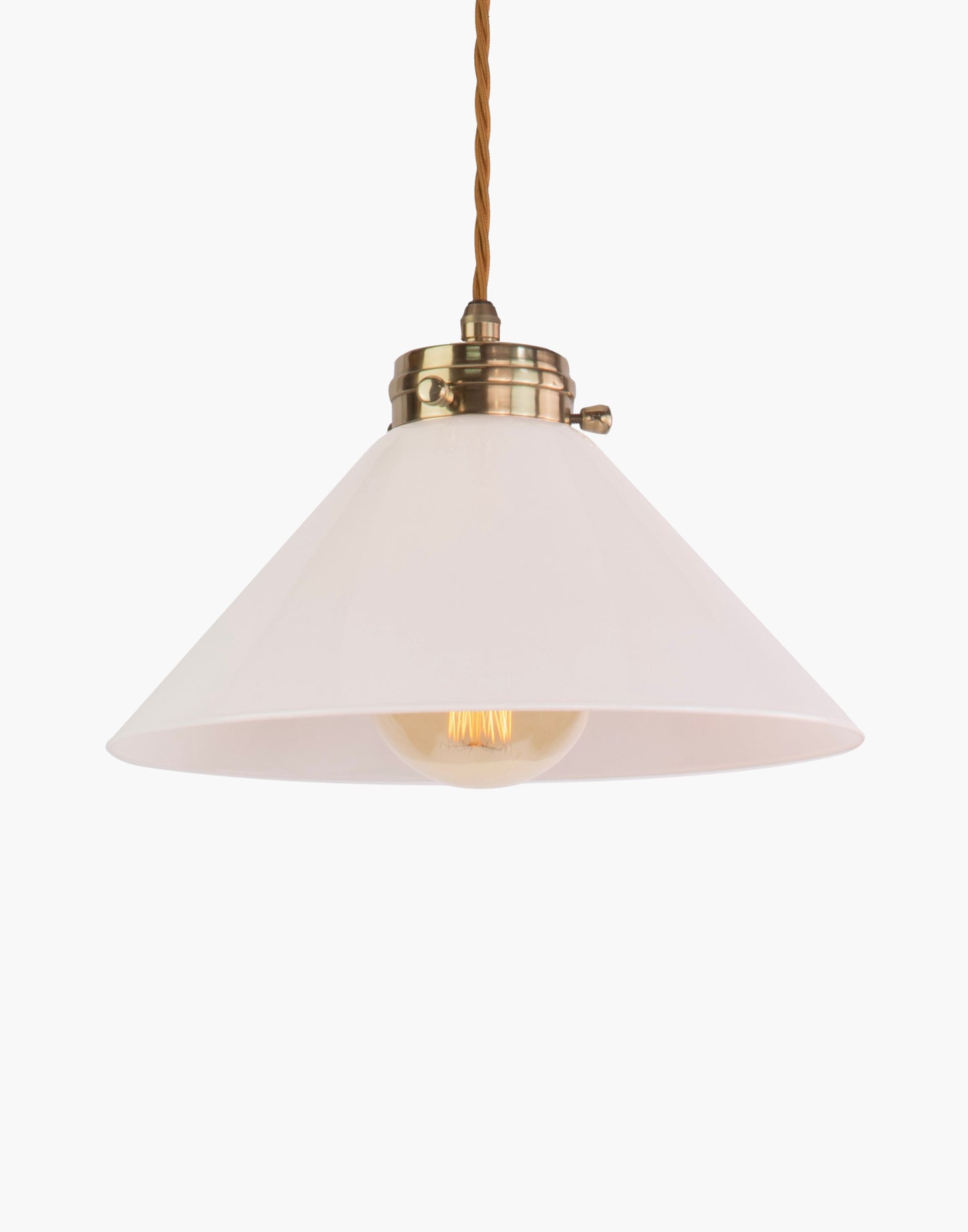 Pendant light in solid brass with classic silhouette, adjustable height, and refined transitional design for interior spaces