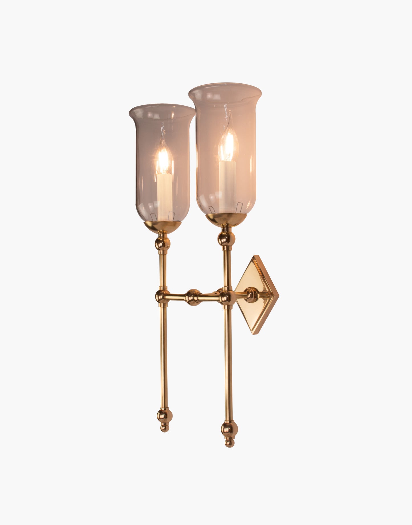 Tall Storm Glass twin wall sconce with diamond-shaped brass back plate
