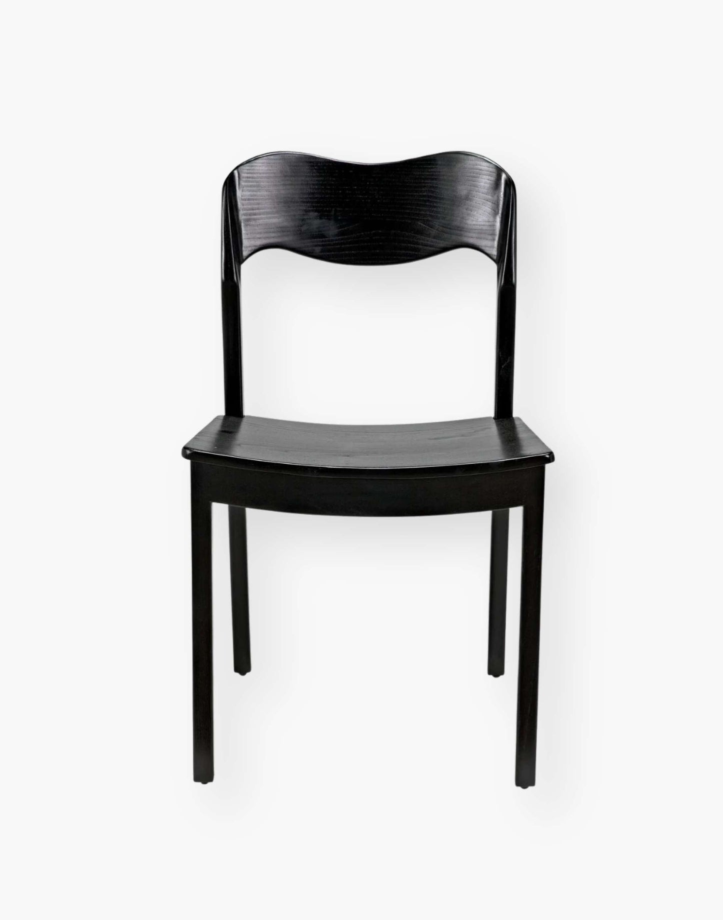 Dining chair with a subtly scalloped back and a curved seat with a black-finished sungkai wood frame.
