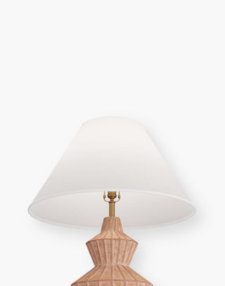 Table lamp in white-washed terracotta with hand-ribbed linear detailing with a tapered, ivory microfiber shade lined in off white cotton.