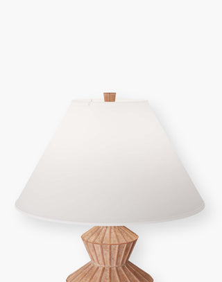 Table lamp in white-washed terracotta with hand-ribbed linear detailing with a tapered, ivory microfiber shade lined in off white cotton.