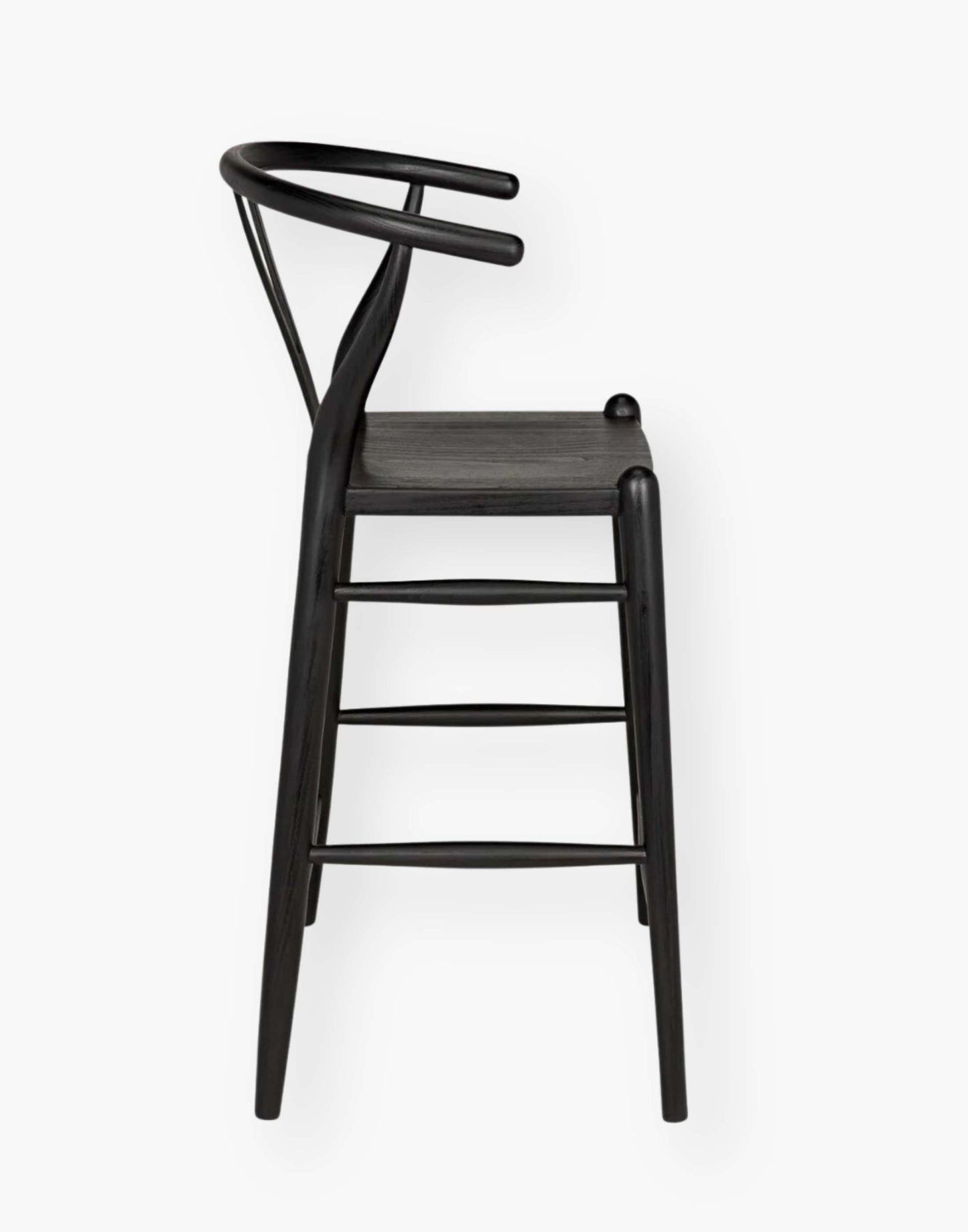 Counter stool that is hand-carved of sungkai wood with a charcoal black finish.