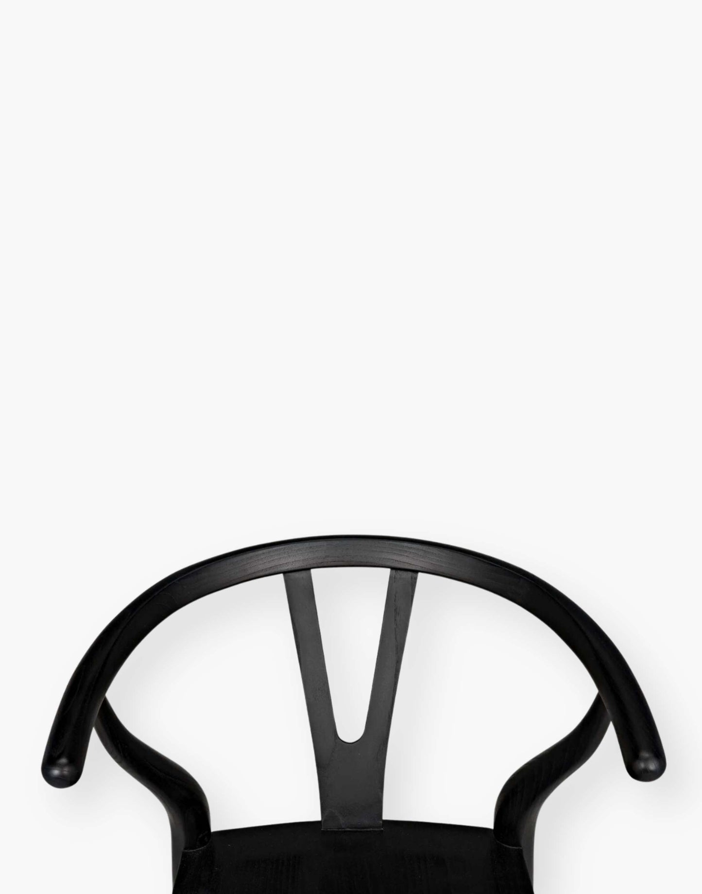 Counter stool that is hand-carved of sungkai wood with a charcoal black finish.