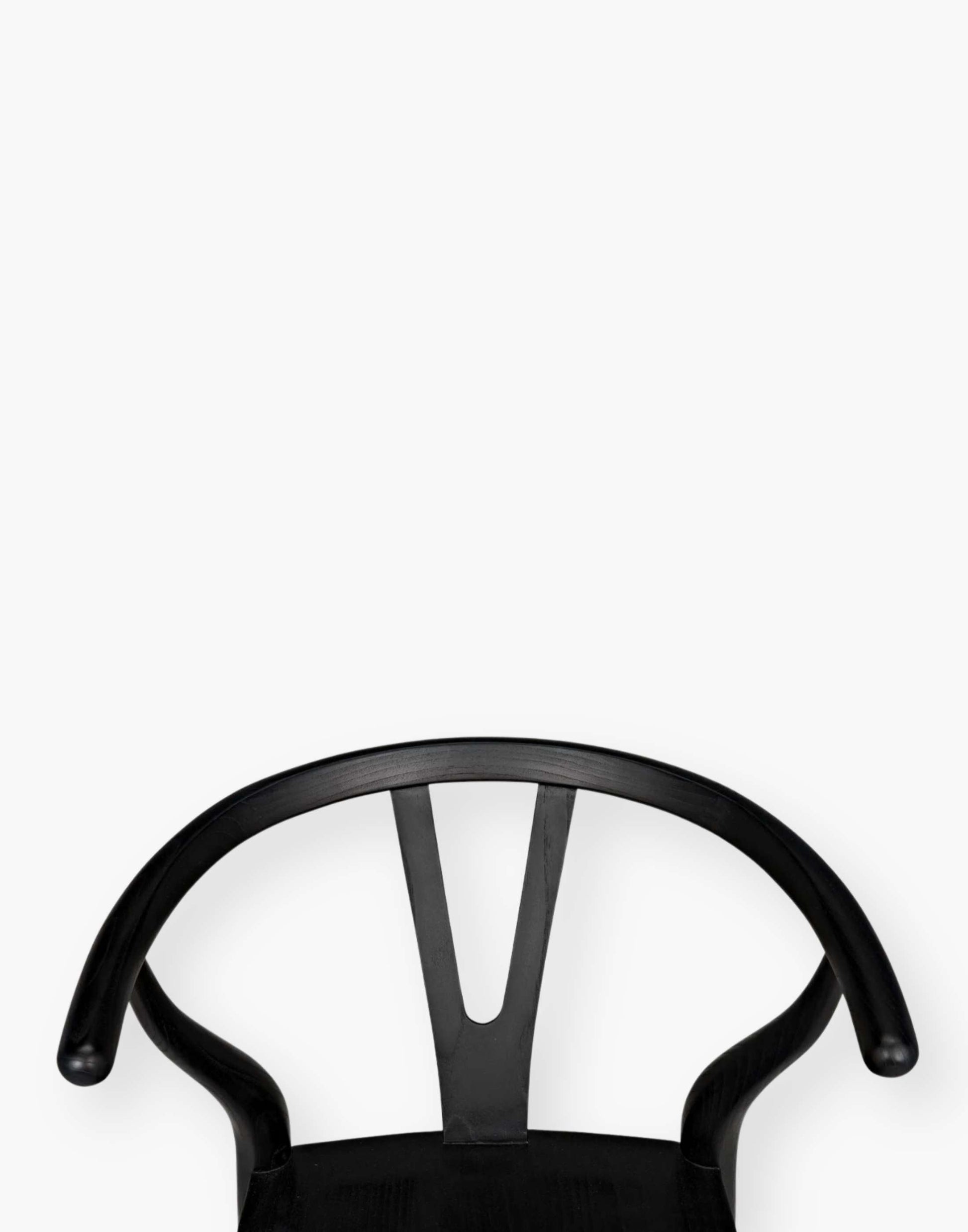 Counter stool that is hand-carved of sungkai wood with a charcoal black finish.