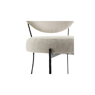 Upholstered dining chair with a hammered iron frame and a linen wrapped seat and backrest.